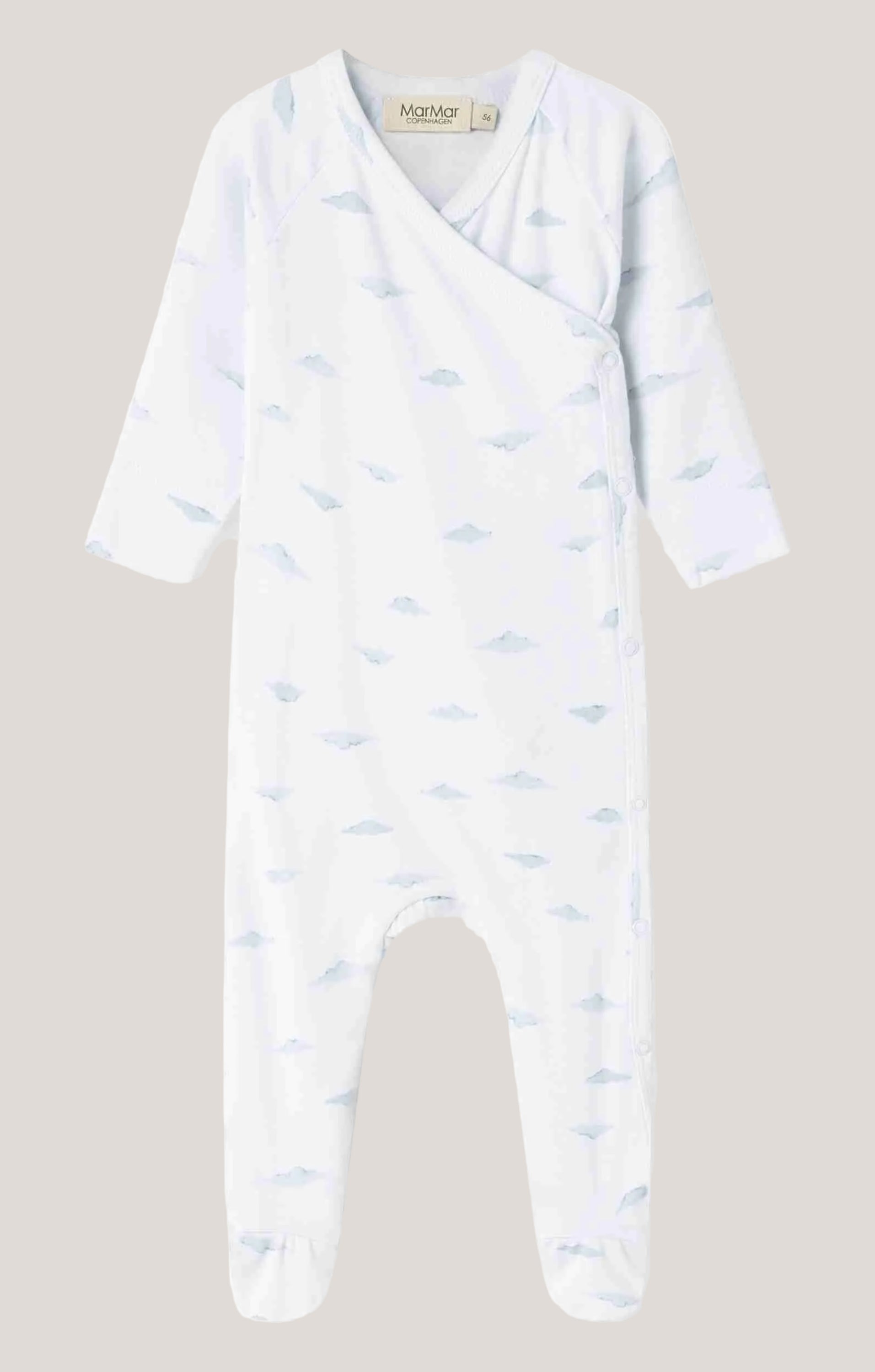 White baby onesie with blue patterns on a white background