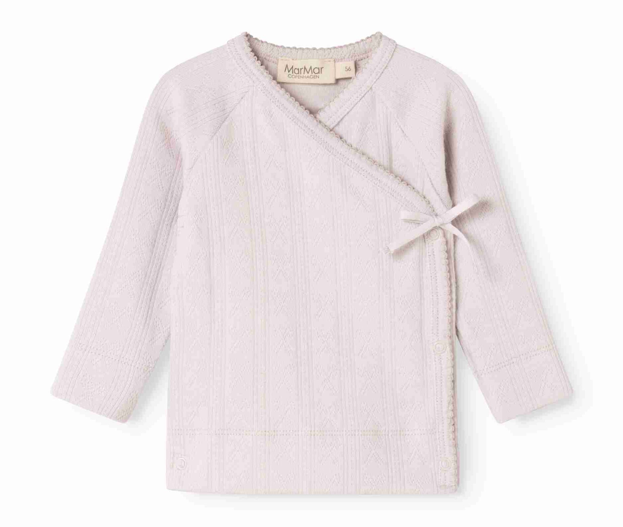 A light pink ribbed knit wrap cardigan for toddlers, featuring a crossover V-neck, long sleeves, and a small bow detail on the front, shown against a plain white background.