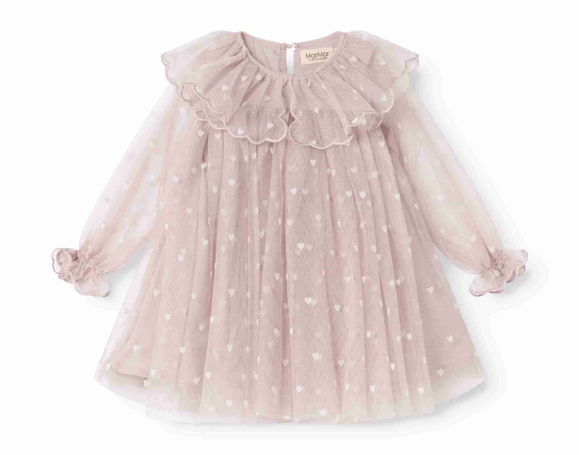 A light pink long-sleeve tulle dress for toddlers, featuring a large ruffled collar, delicate white embroidered polka dots, and matching ruffled cuffs on the sleeves, shown against a plain white background.