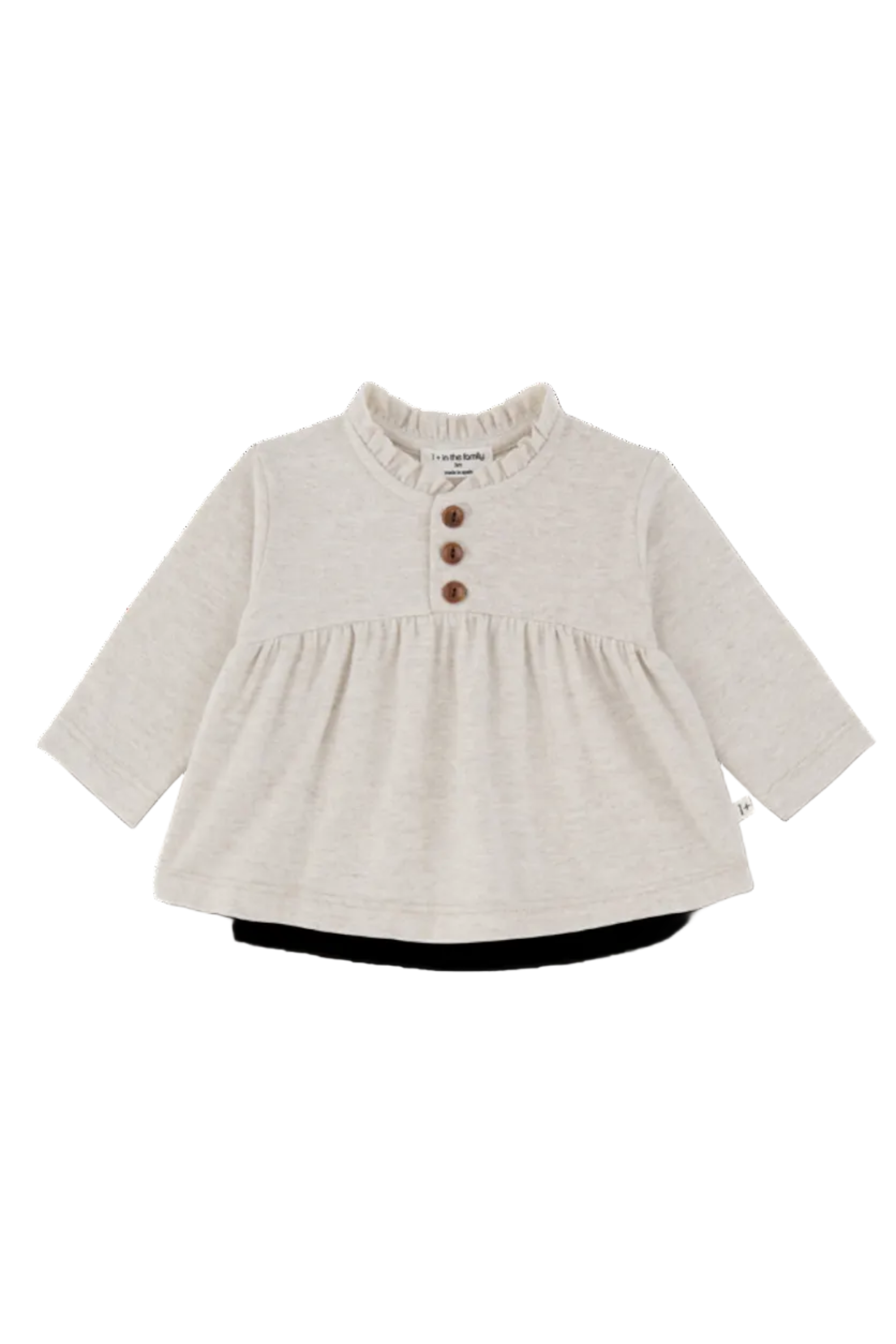 A light beige baby long-sleeve top with a ruffled mock neck, three brown buttons on the chest, and a gathered waist seam, shown on a white background.