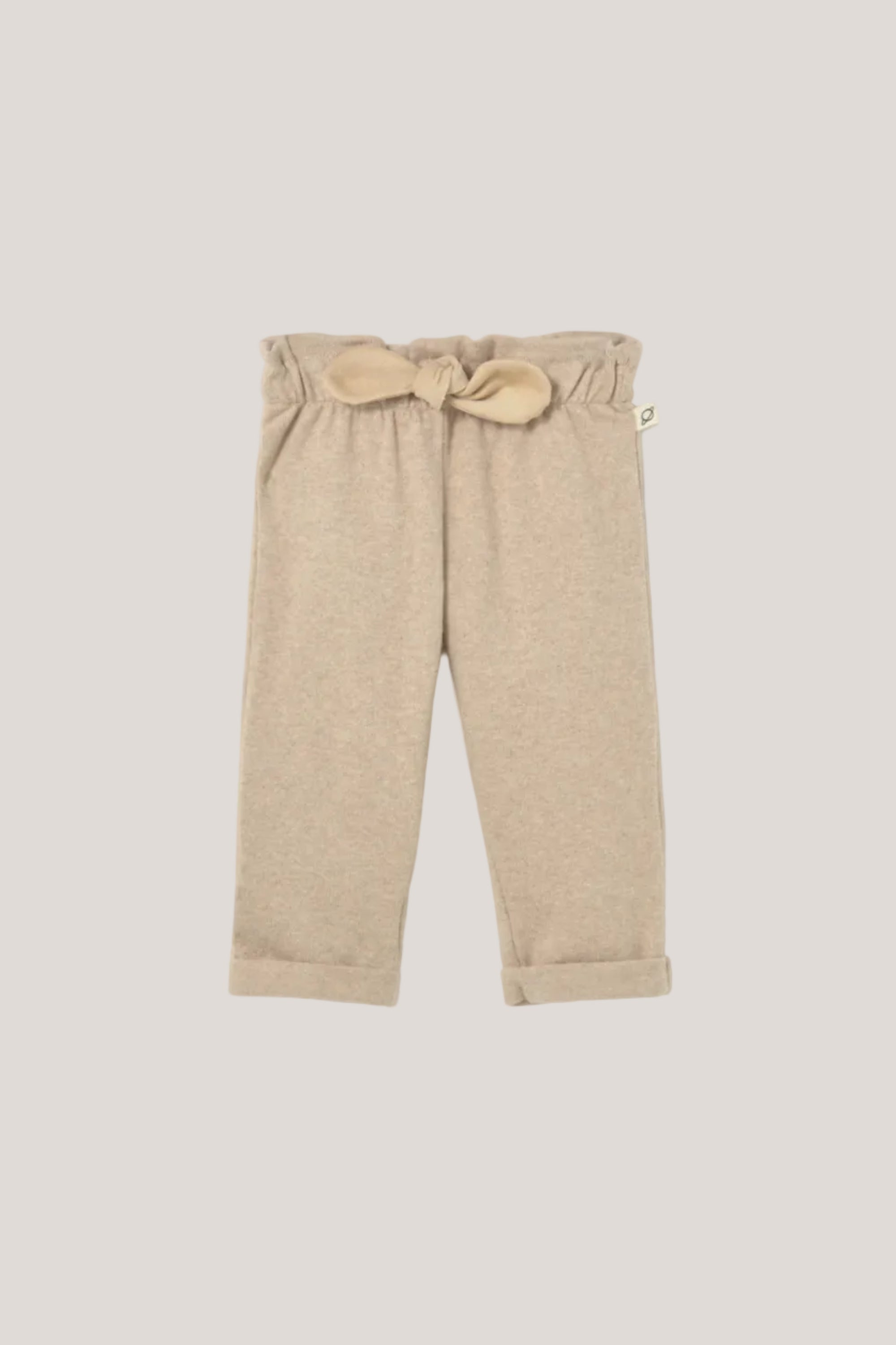 Beige pants with a bow detail on a white background