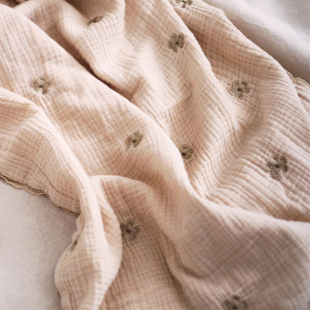 Flower embroidered blanket