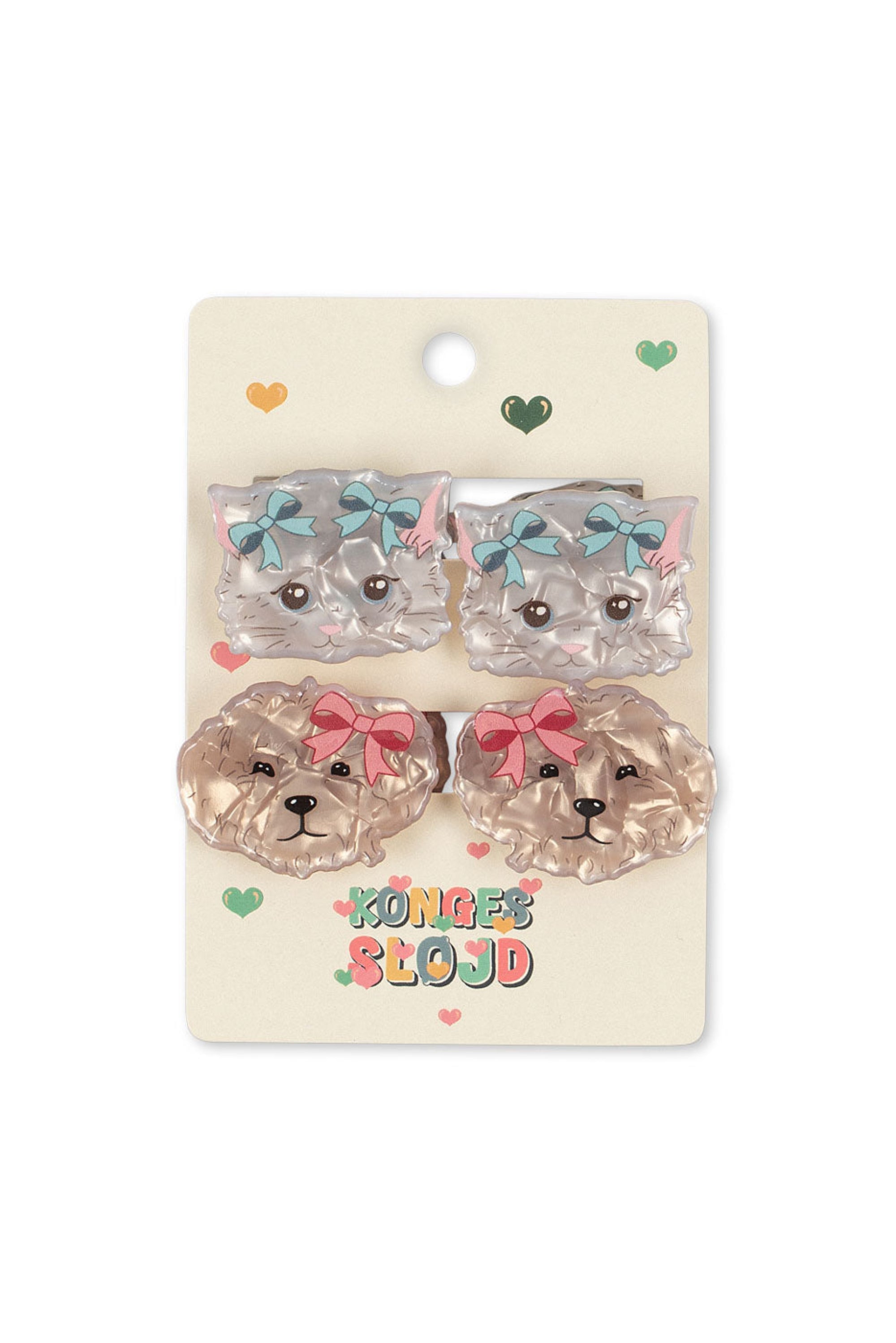 Set of dog-shaped hair clips on a decorative card with colorful text and designs.