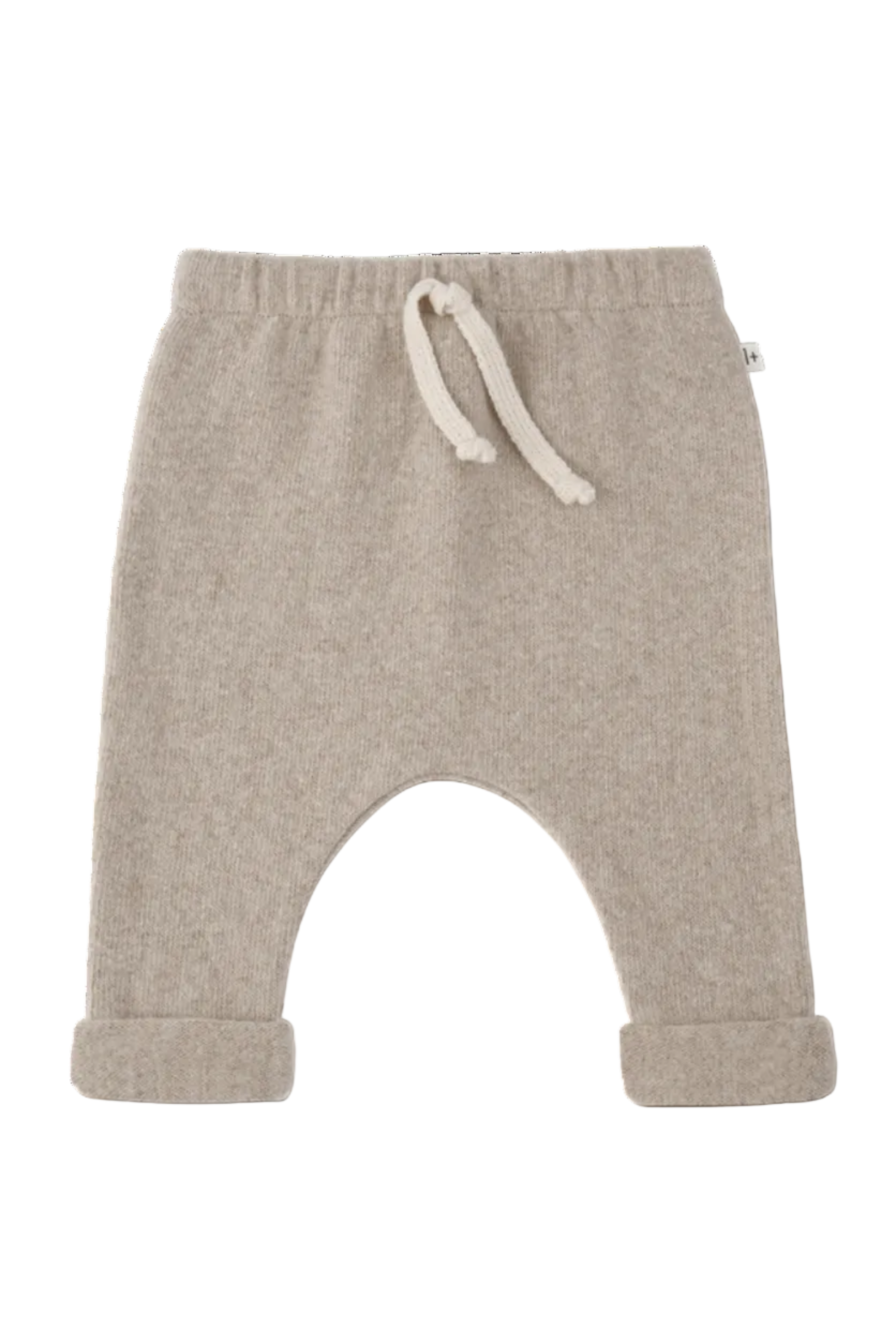 A pair of beige knit baby pants with a wide leg, rolled cuffs, and a cream-colored drawstring at the elastic waistband, shown against a plain white background.