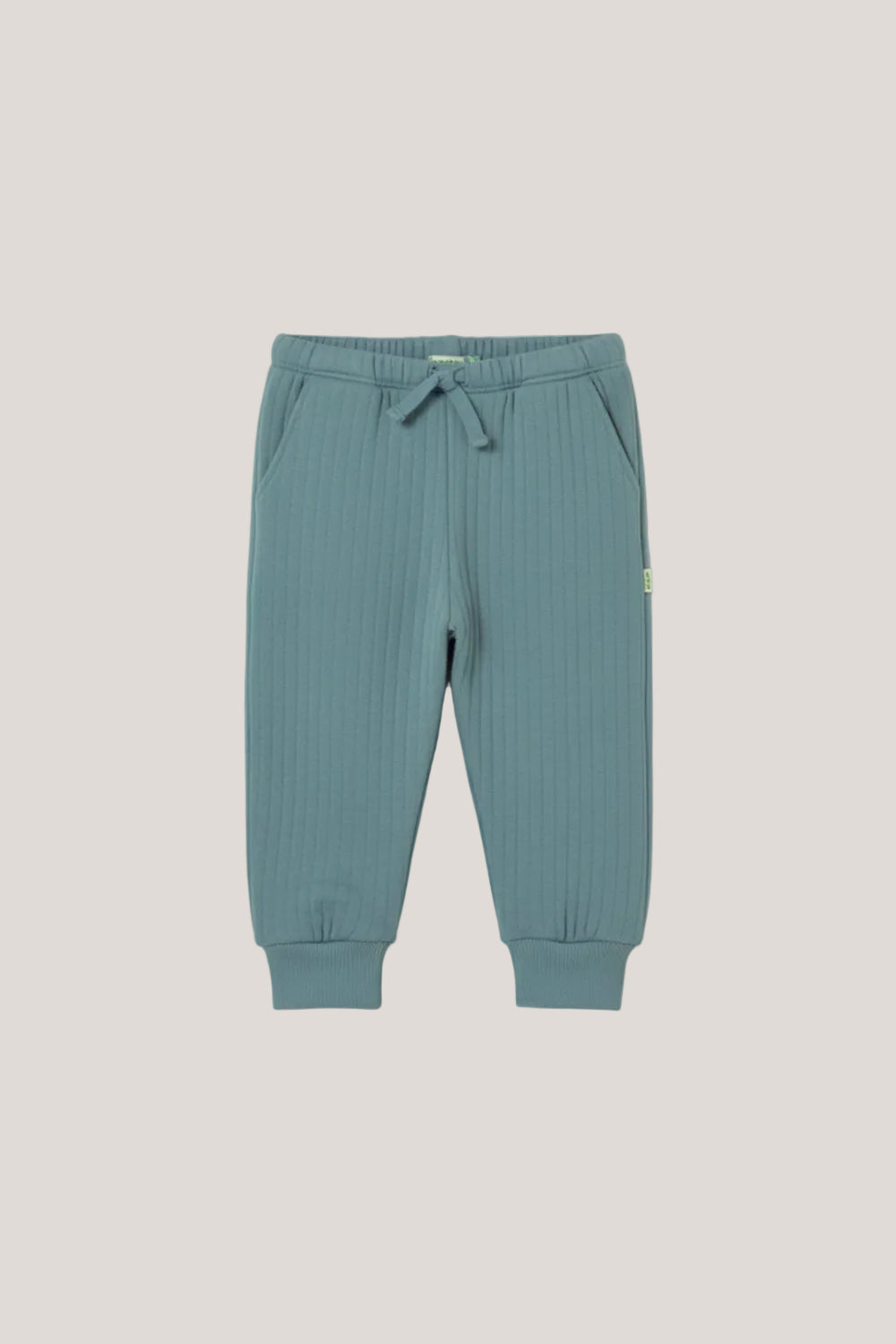 Light blue ribbed pants on a white background