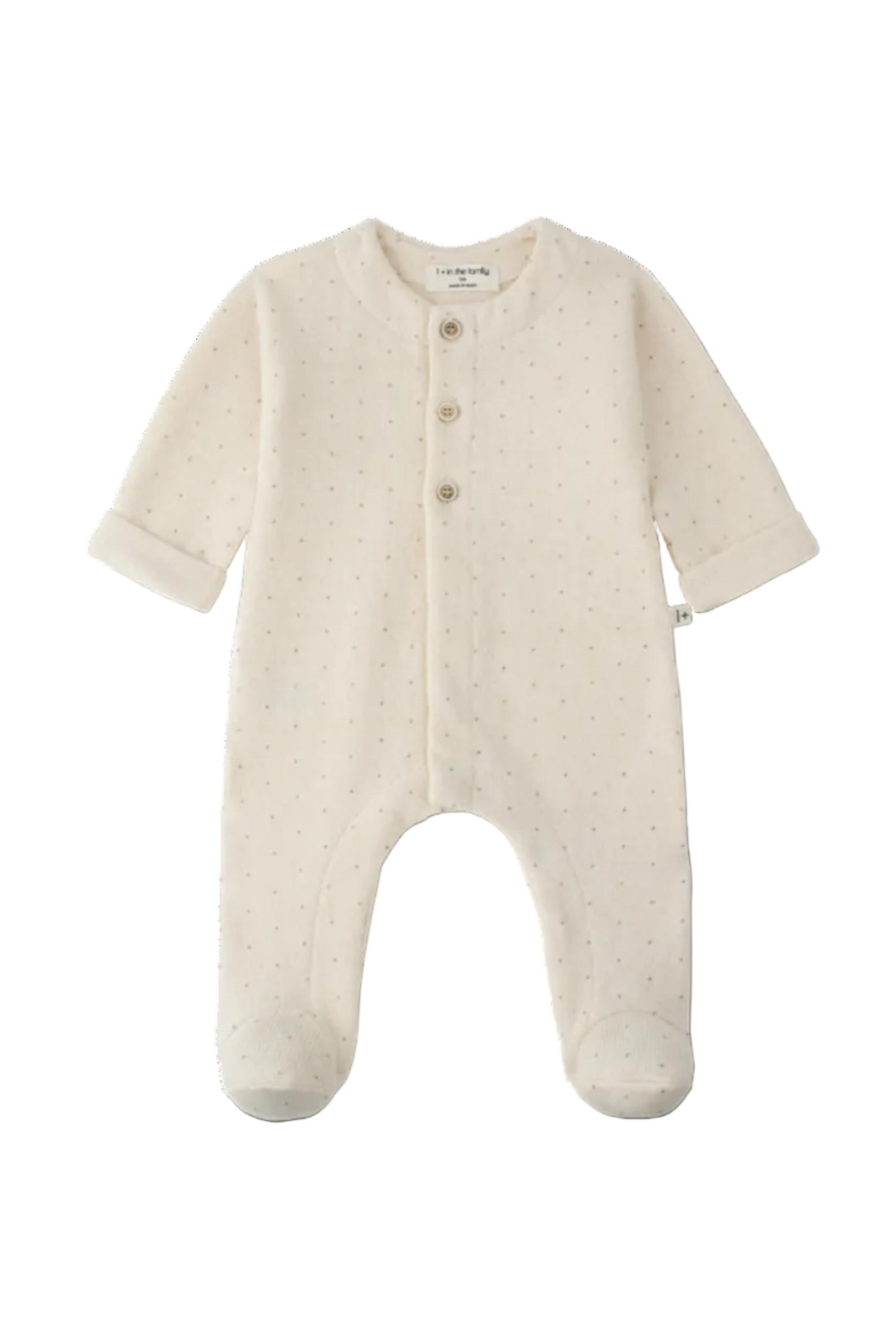An off-white footed sleeper with a tiny dotted pattern, featuring three front buttons and short sleeves, shown on a plain white background.