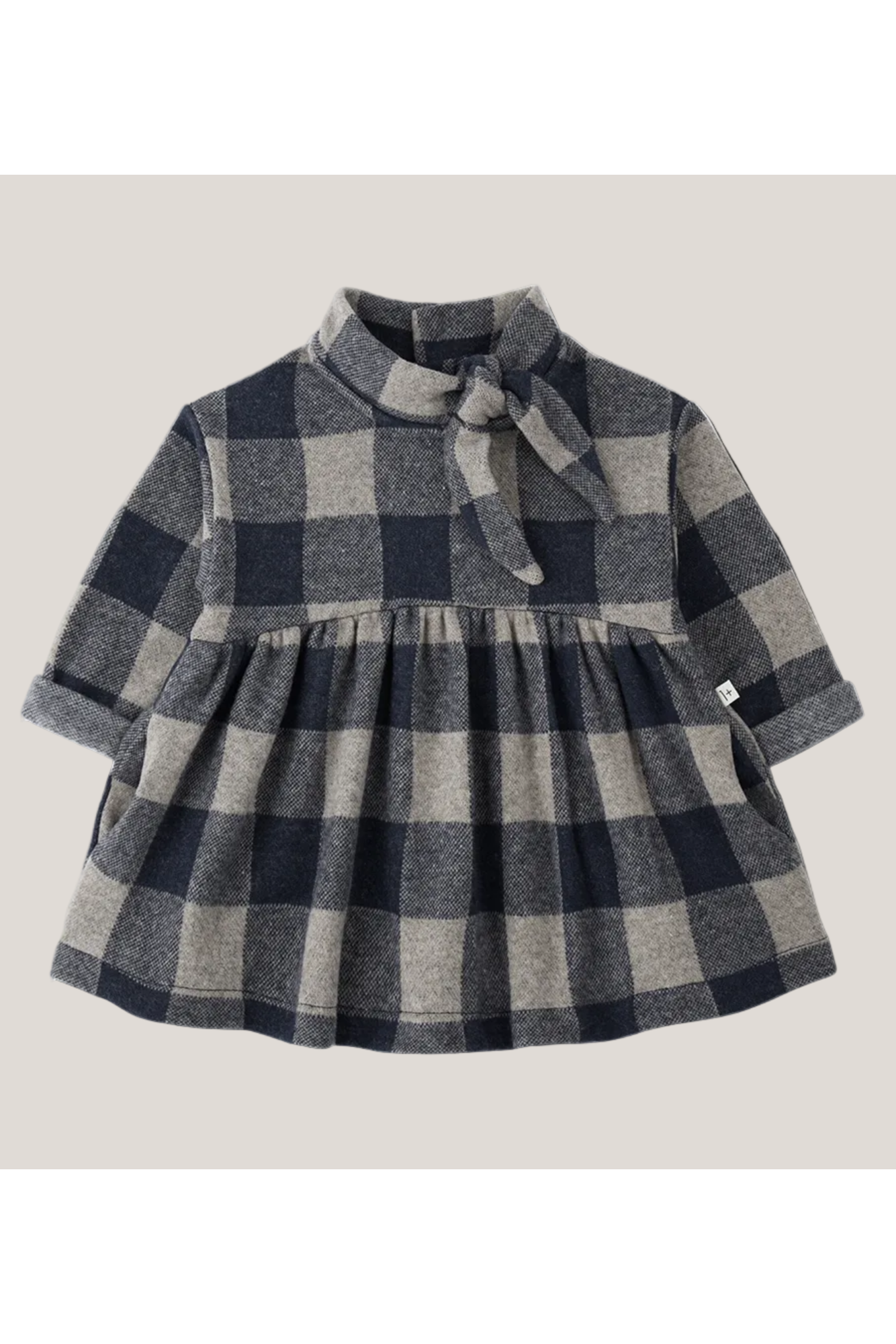 Plaid dress with a bow on a white background