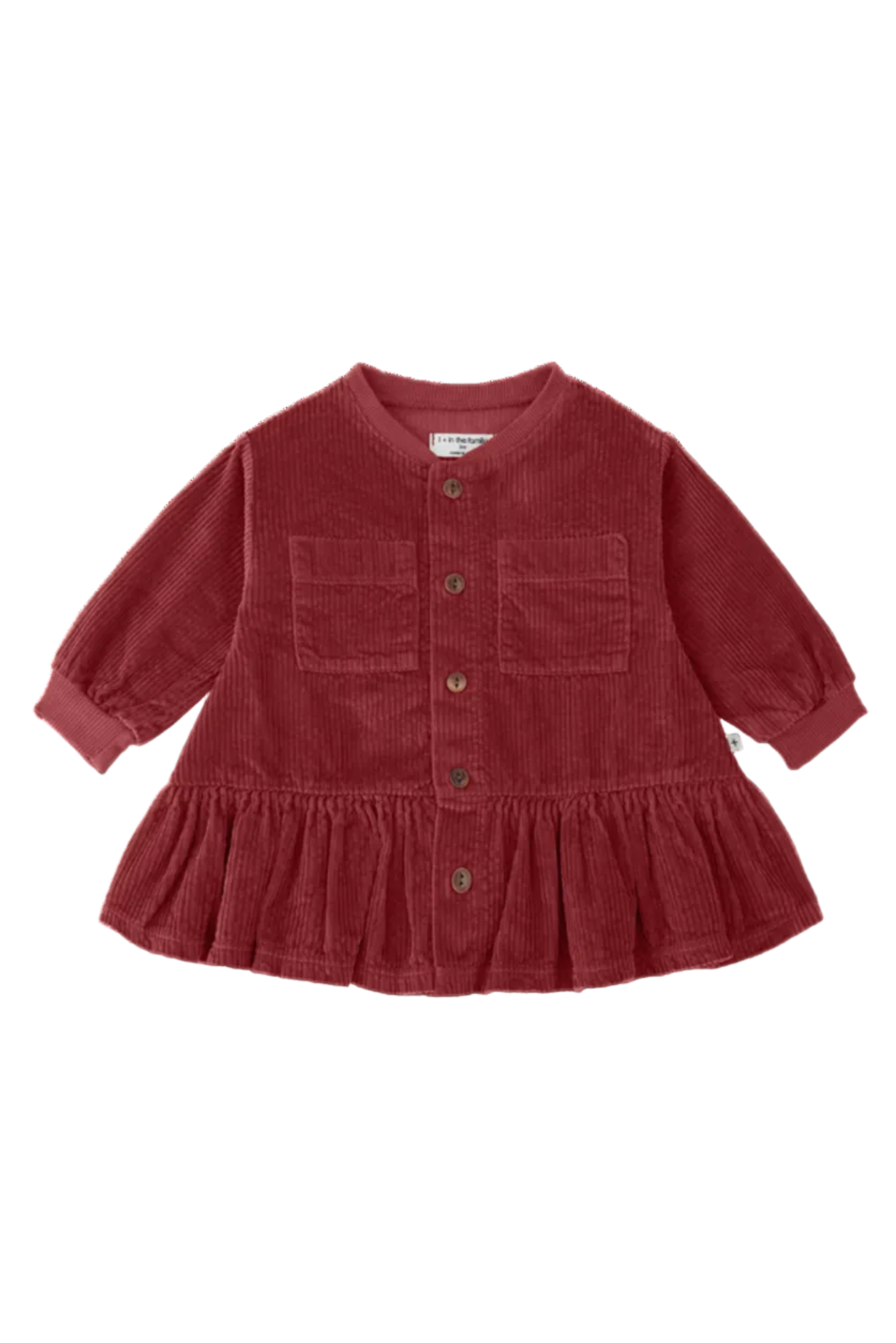 Red corduroy dress with buttons on a white background