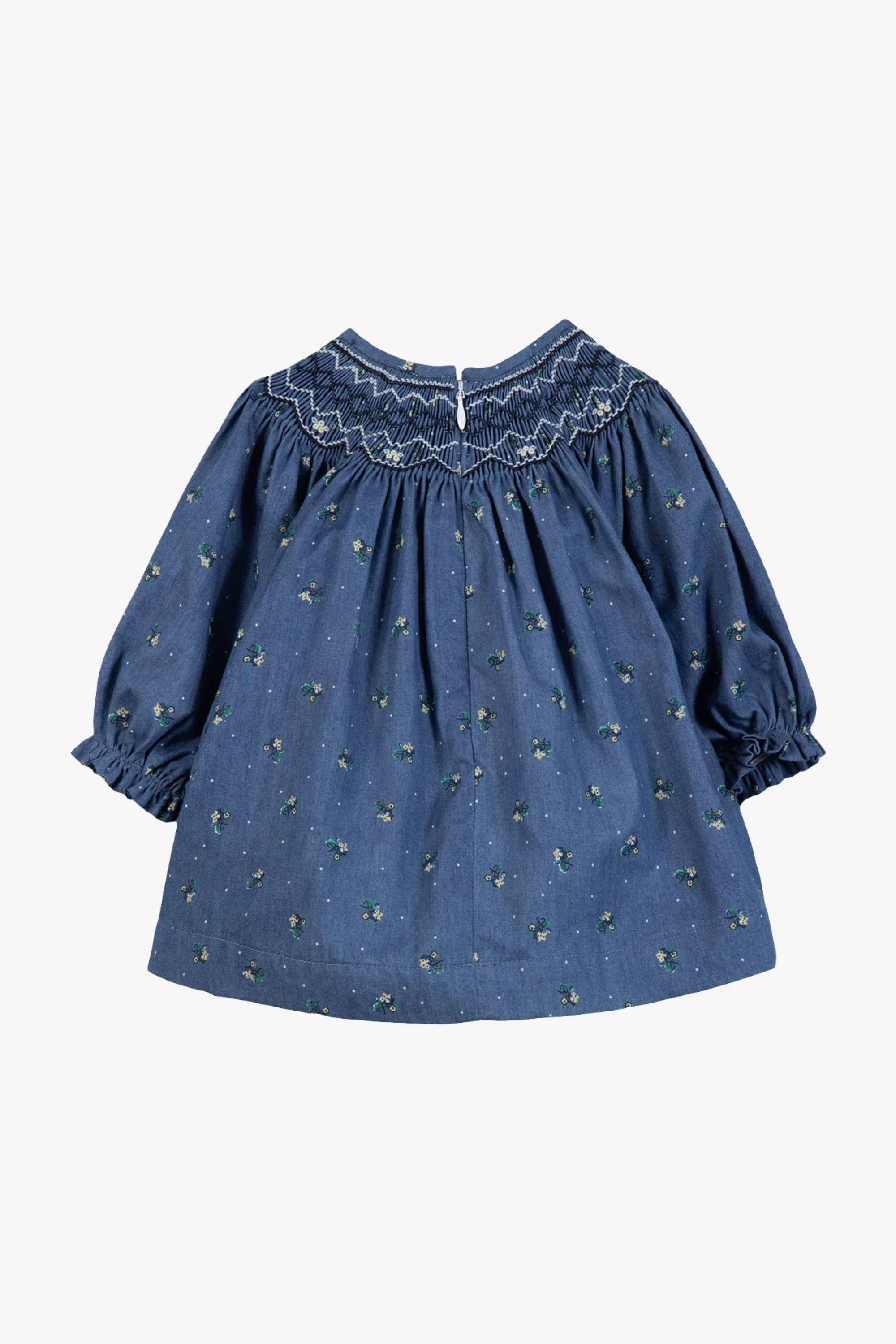Blue dress with floral embroidery on a white background
