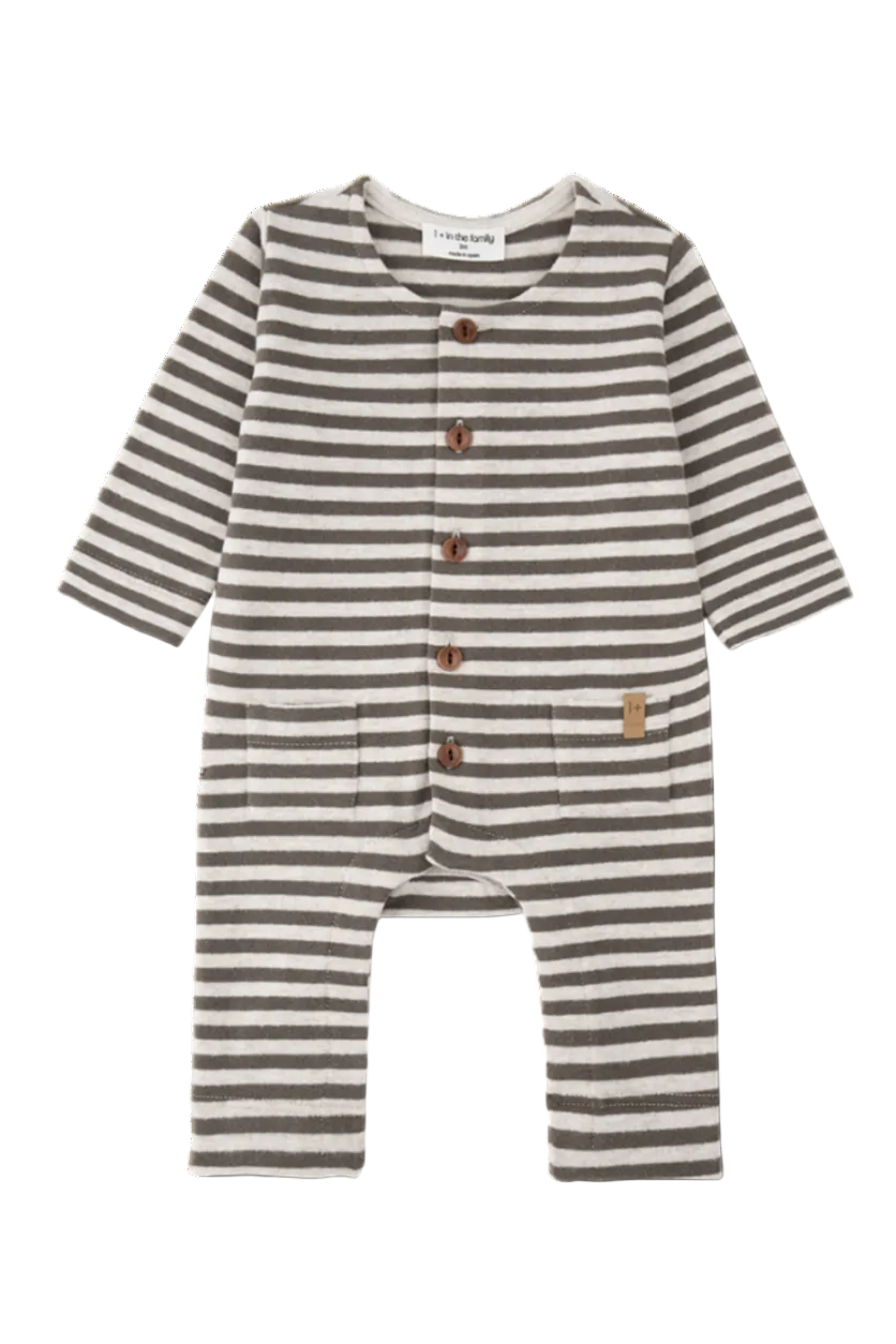 A baby long-sleeve romper with horizontal brown and beige stripes, featuring a snap-button front and a small wooden brand tag on the pocket.