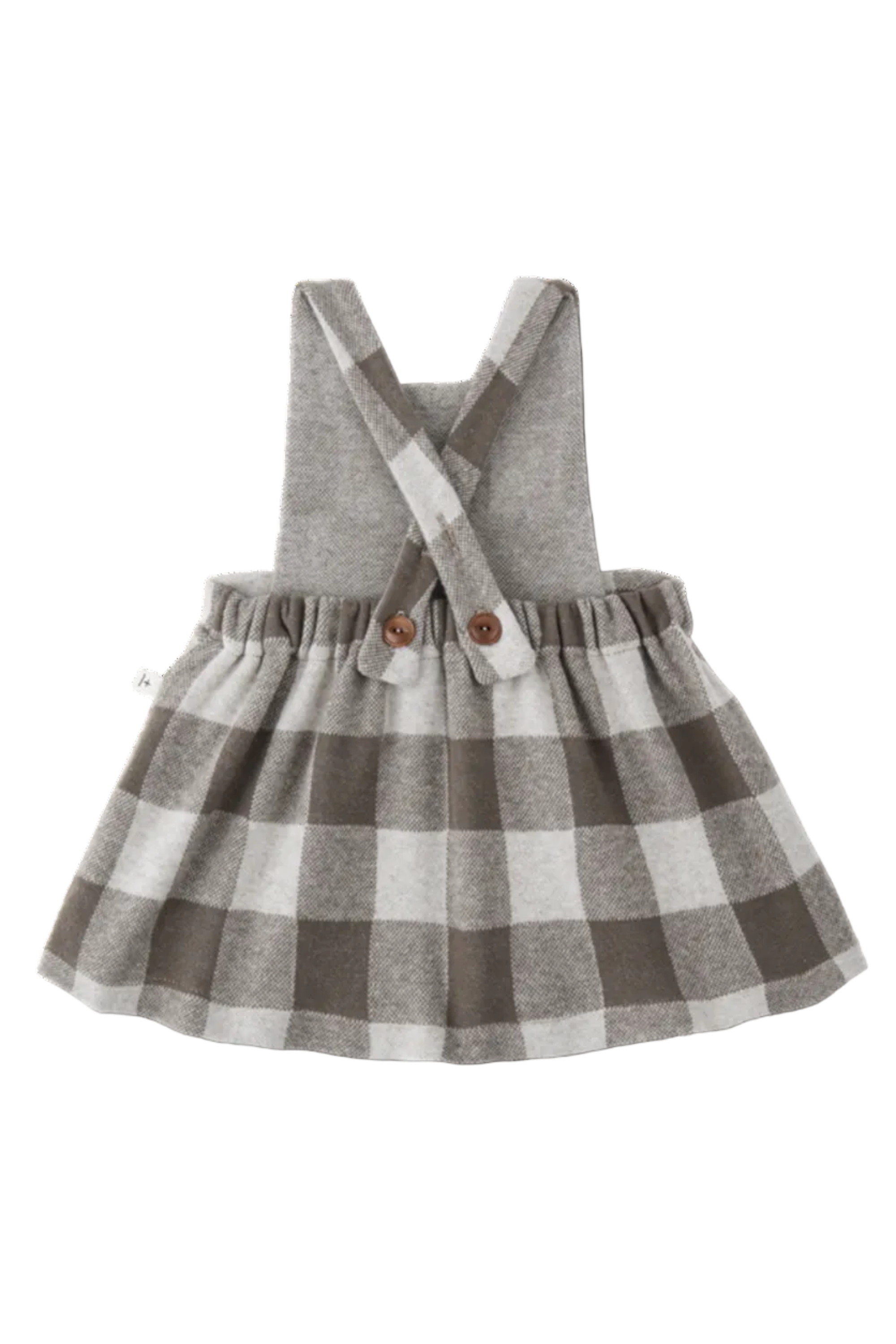 Children's dress with checkered skirt and suspenders on a white background
