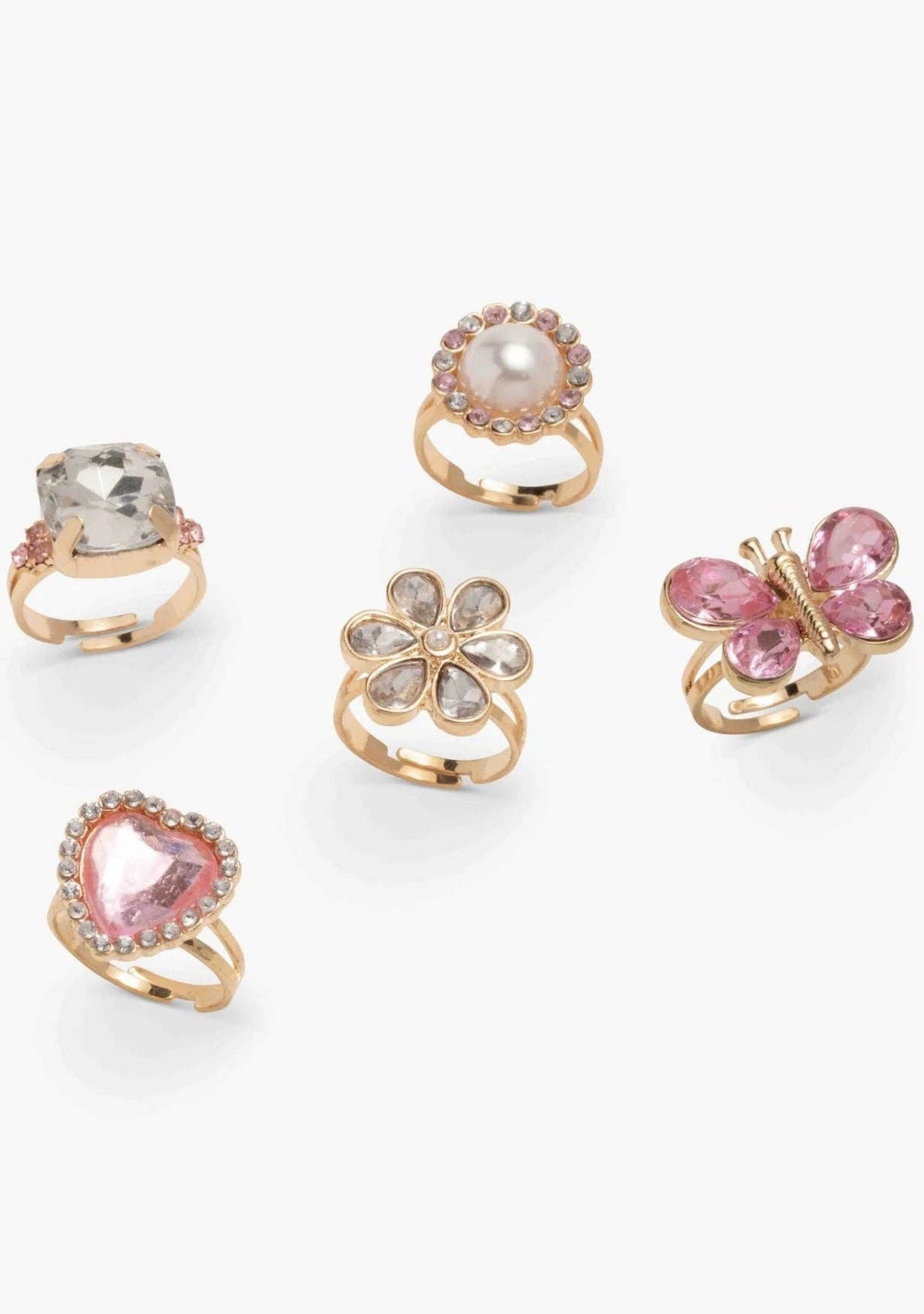 Set of six decorative rings with gemstones on a white background