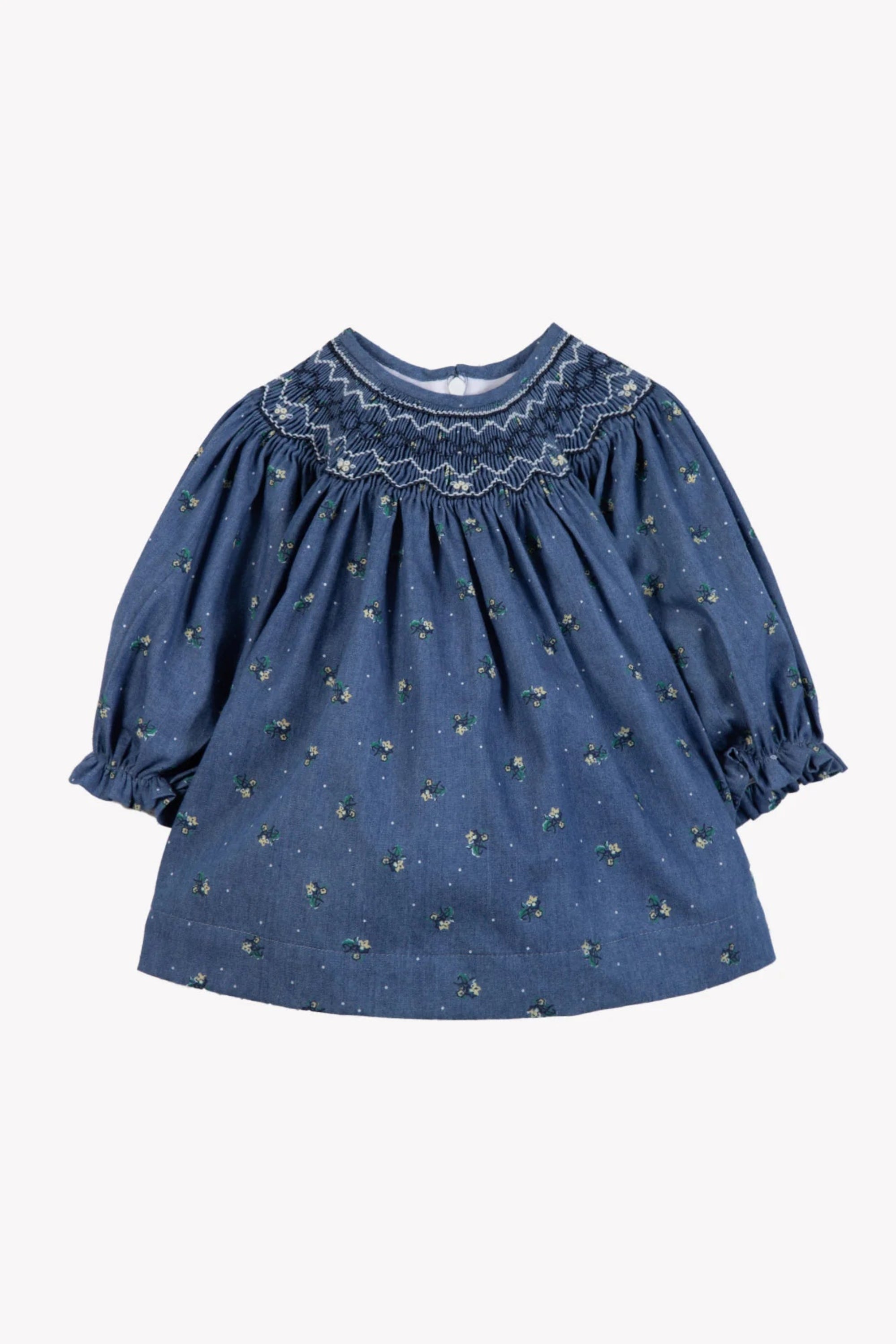 A blue baby girl's blouse with a delicate yellow and green floral print, featuring a smocked round neckline and puff sleeves, shown against a plain white background.