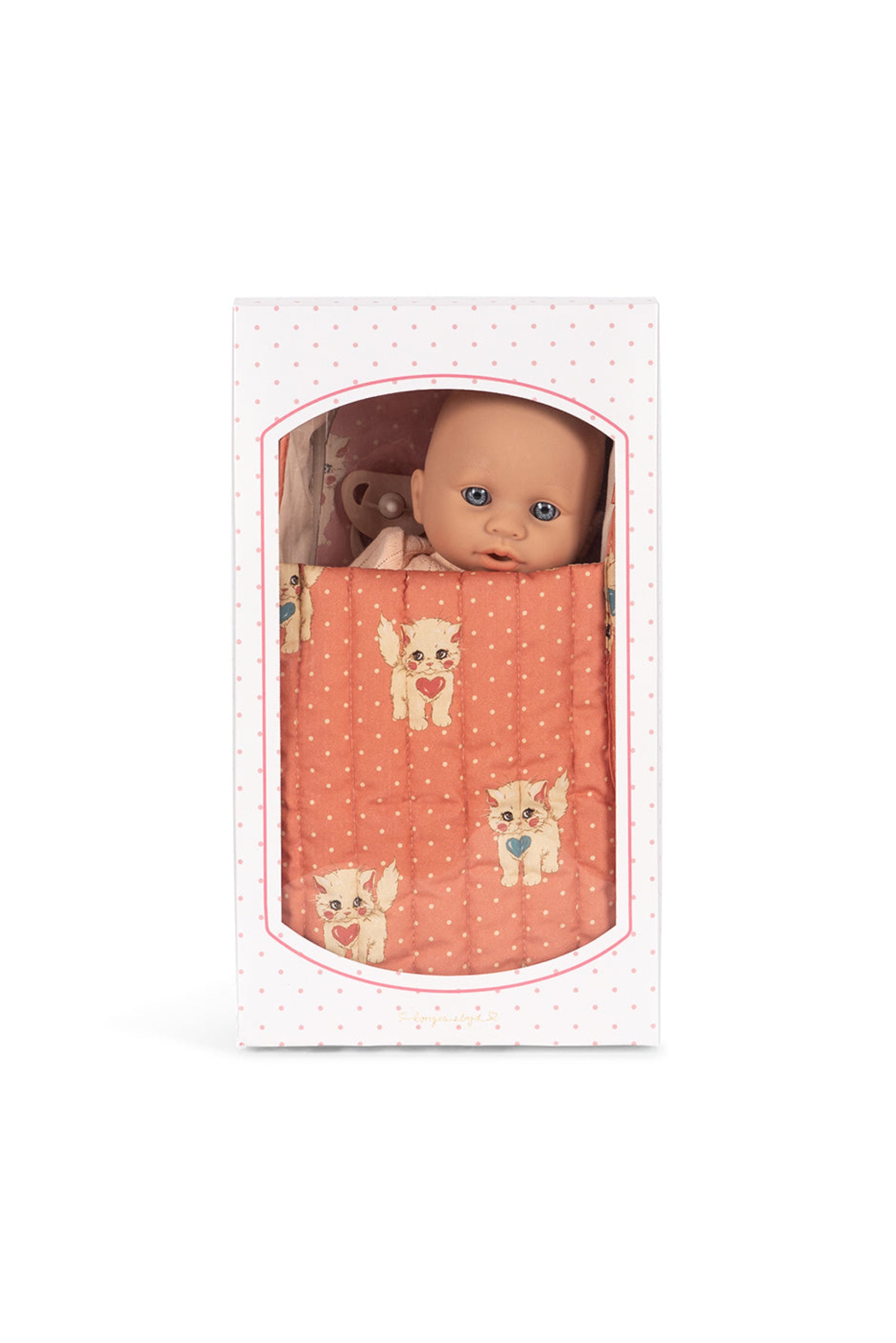 Baby doll in a packaging with a pink patterned cover