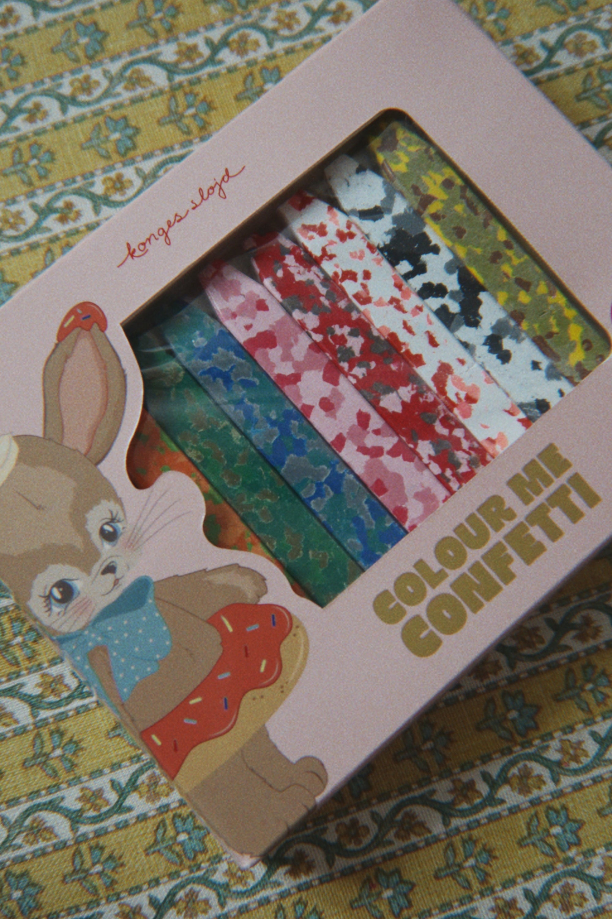 Box of 'Colour Me Confetti' with a bunny design on a patterned background