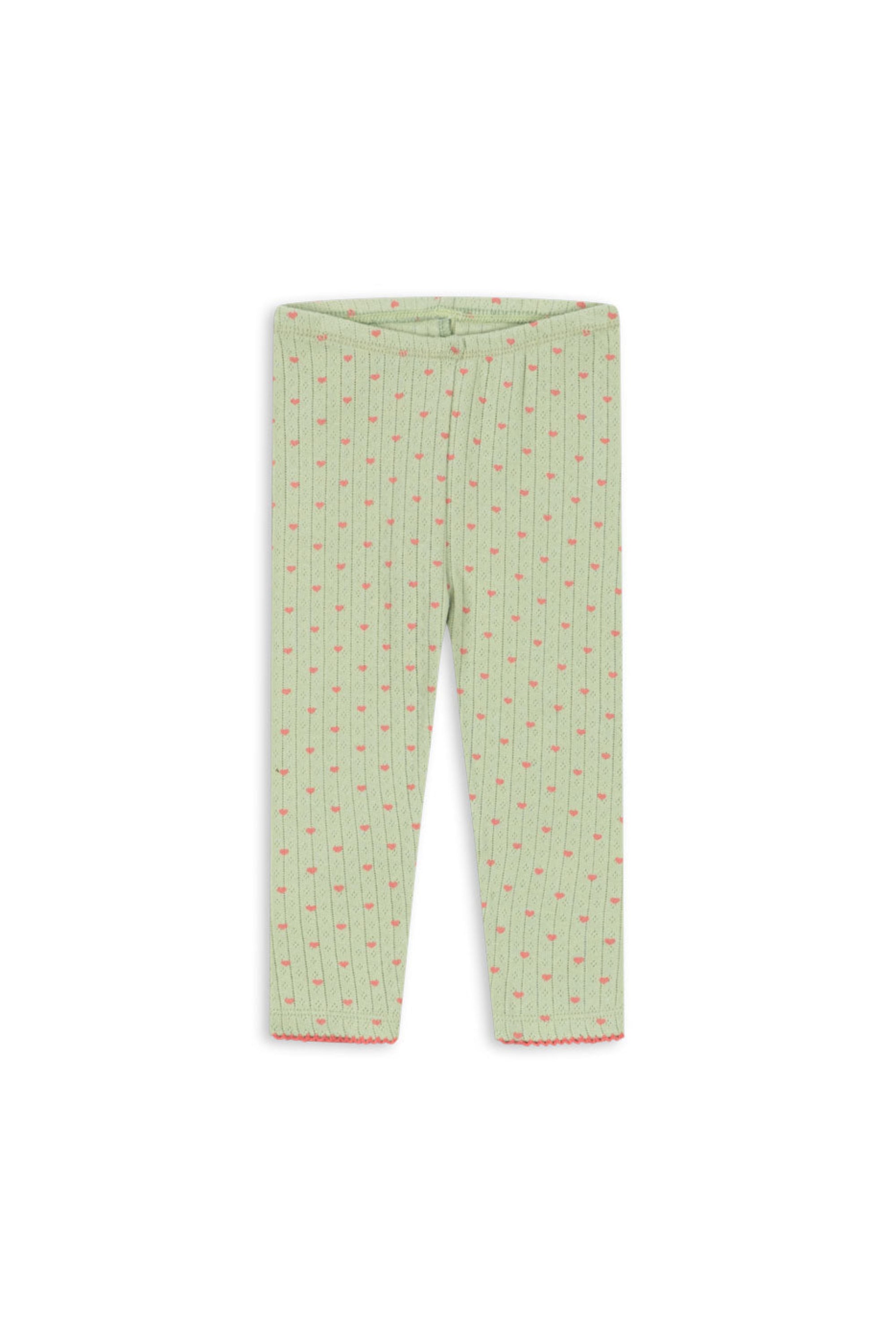 Light green children's leggings with a small red and yellow floral pattern, shown flat against a white background.